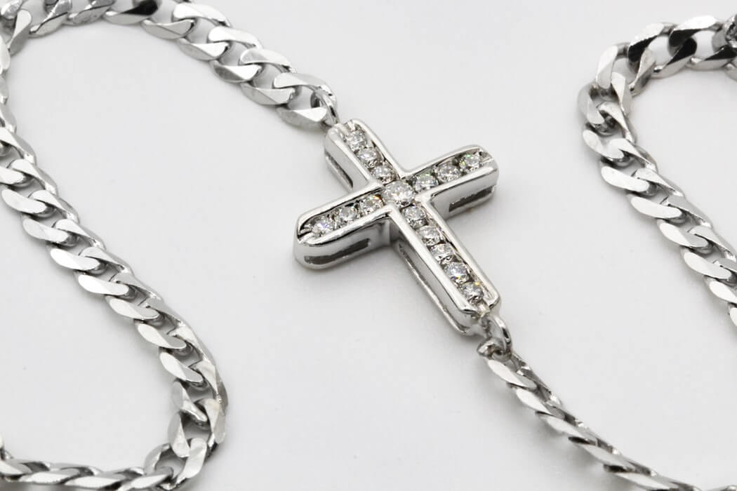 Cross symbol in a necklace