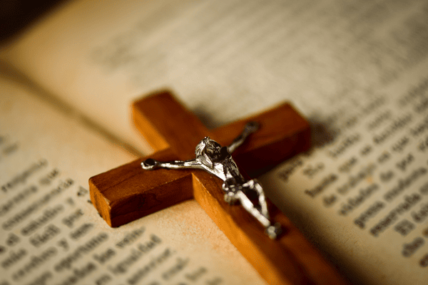 crucifix on a bible