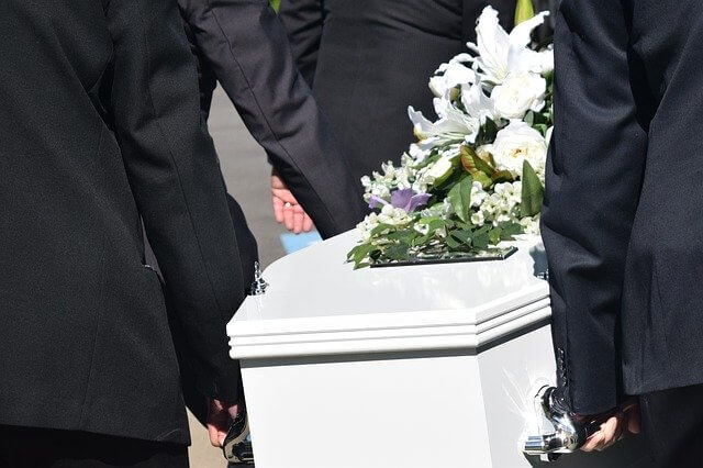 Men carrying casket black