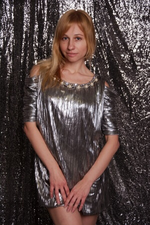 Girl wearing silver color dress