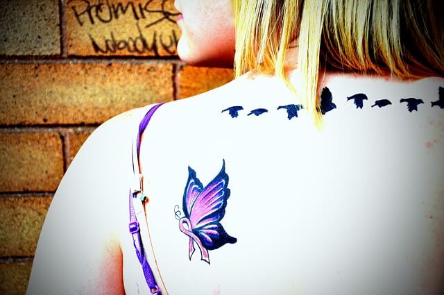 butterfly tattoo on woman's back