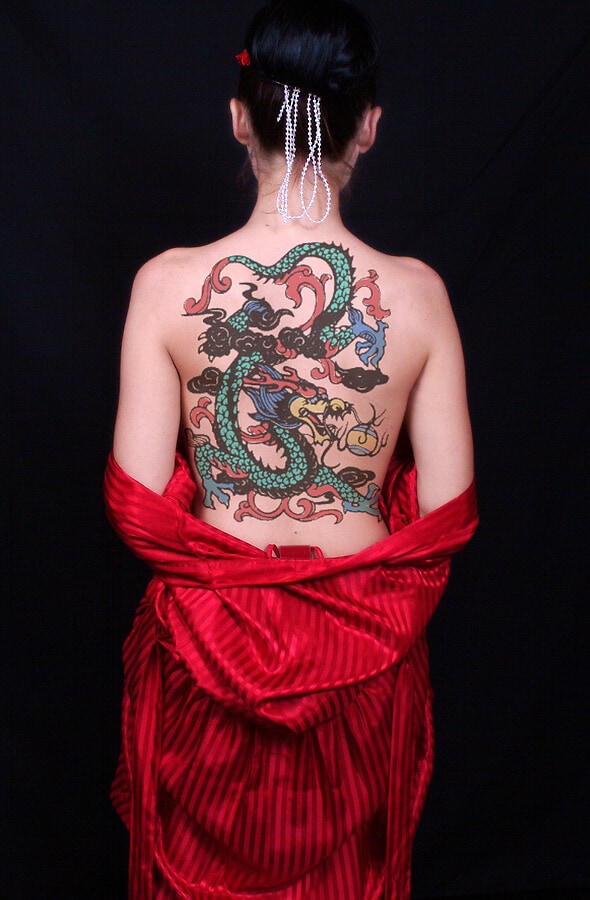 Girl with back dragon tattoo