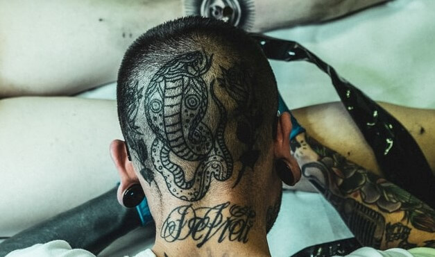 Cobra snake tattoo on head