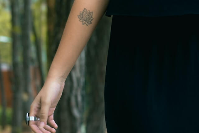 Lotus flower tattoo on arm