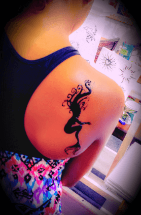 Mermaid tattoo girl's back