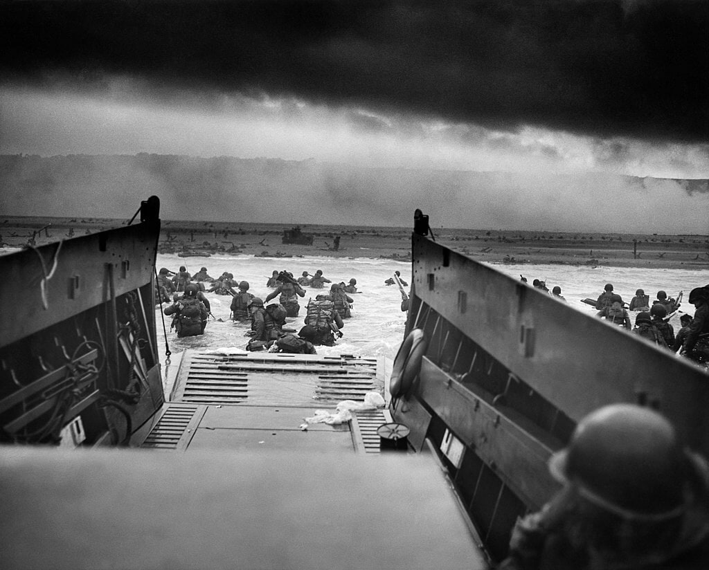 Troops wading into the Omaha Beach from the USS Samuel Chase