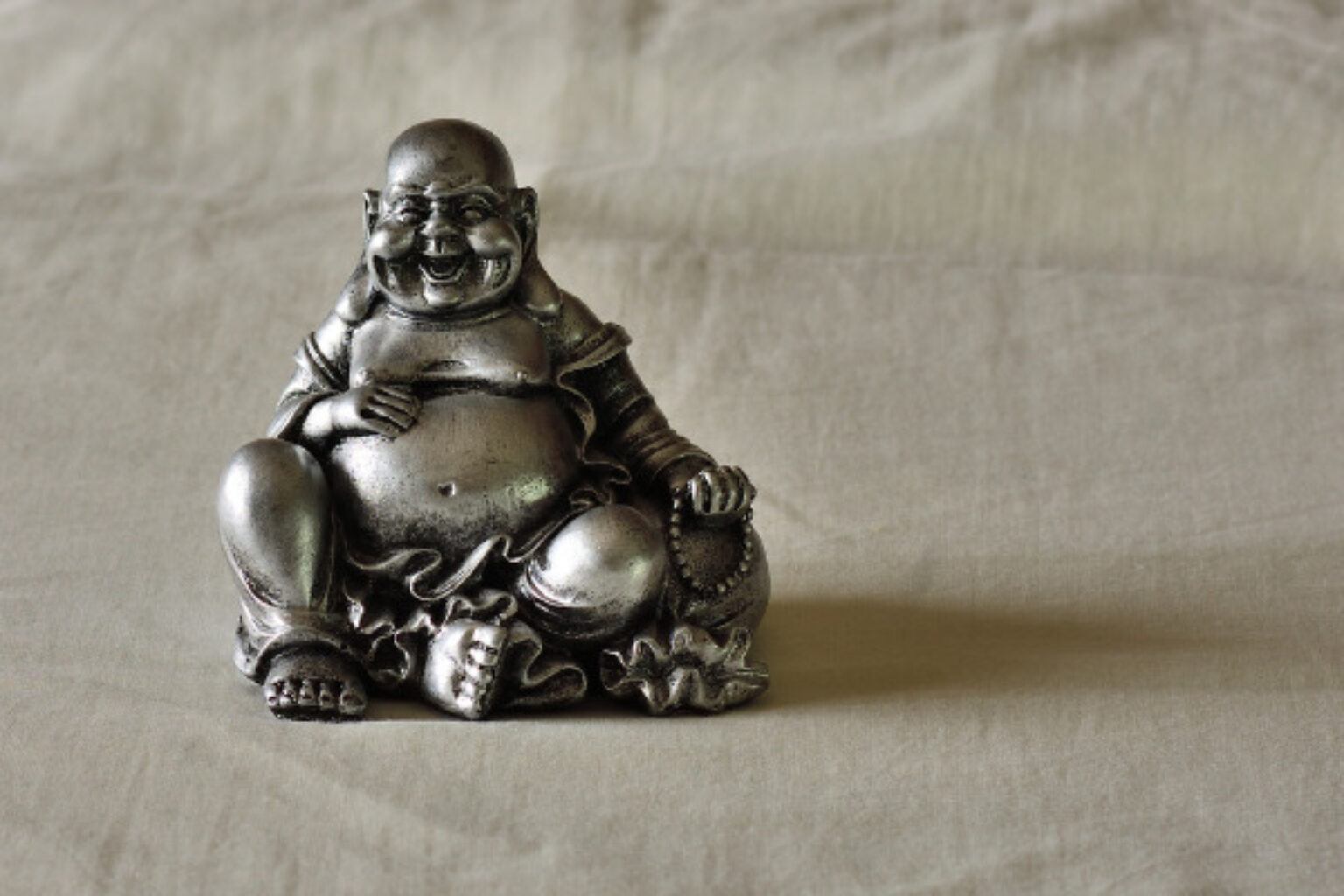 What Does the Laughing Buddha Symbolize? Symbol Sage
