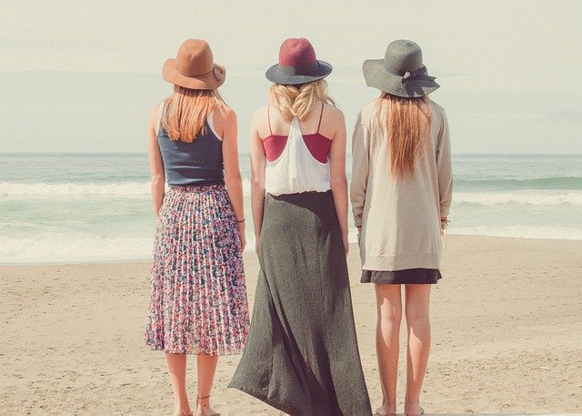 Three women looking at the sea