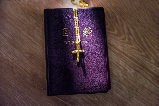 bible and necklace christianity