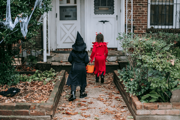 kids going to a house for a trick or treat