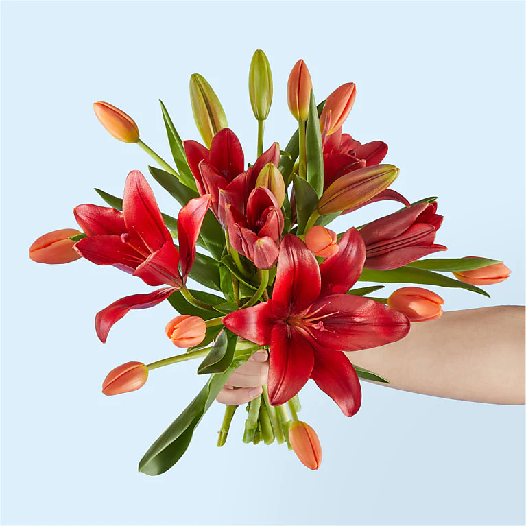 Foxtrot bouquet with lilies and orange tulips
