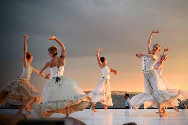 women in white dress dancing