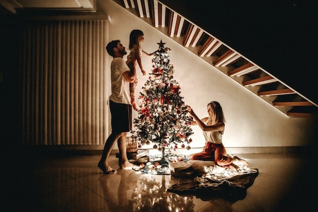 a family with christmas tree