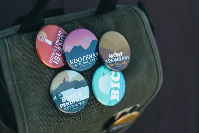 Badges on a grey backpack