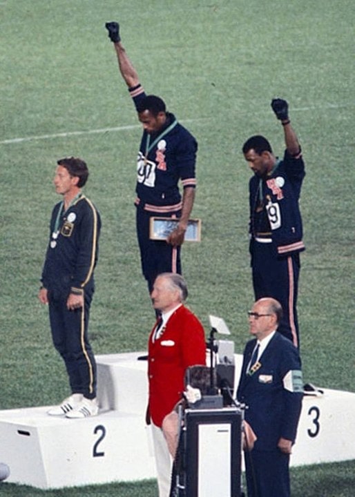  Tommie Smith and bronze medalist John Carlos showing the raised fist