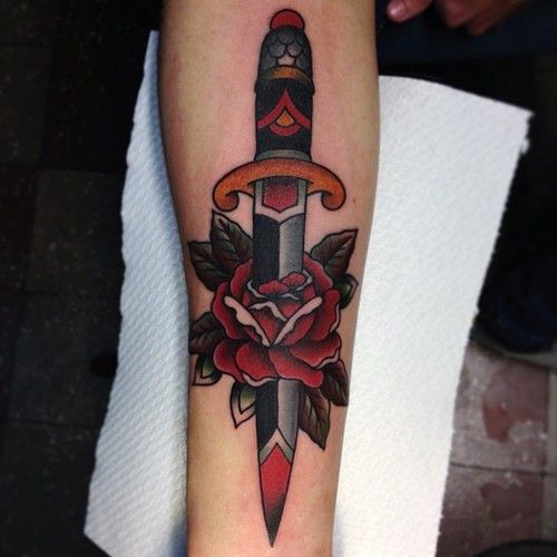 dagger piercing a rose tattoo