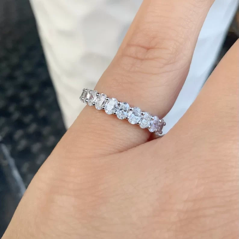a finger with diamond band
