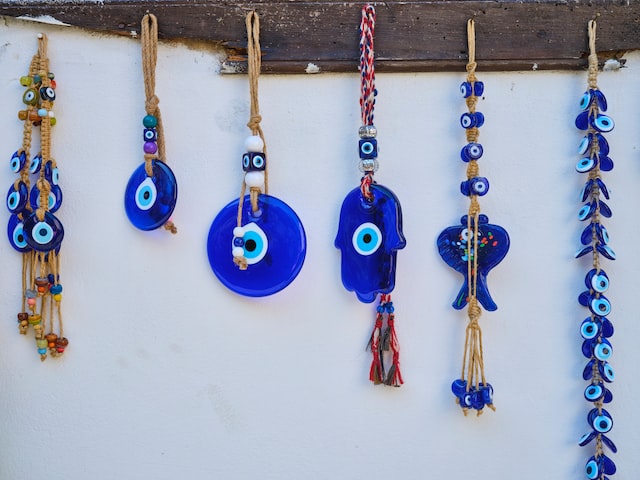 evil eye beads hanging on the wall