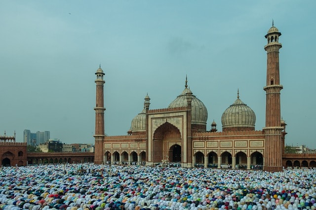 muslims praying in mosques for eid al-adha