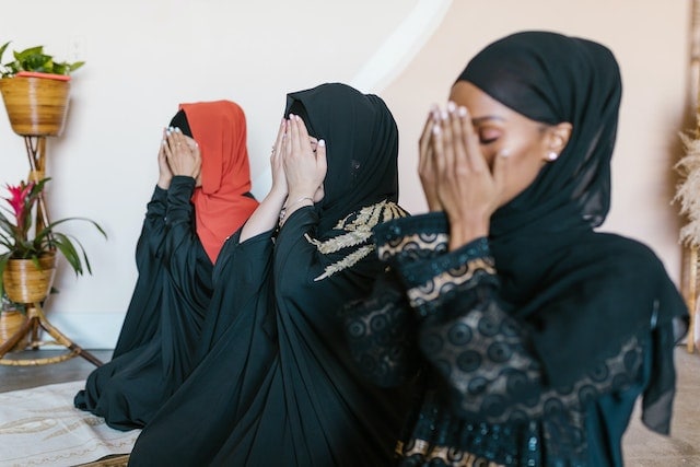 Covering Face With Hands in Prayer