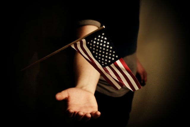 Holding American flag