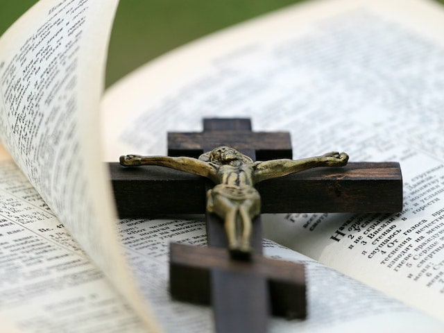 crucifix on top of the bible