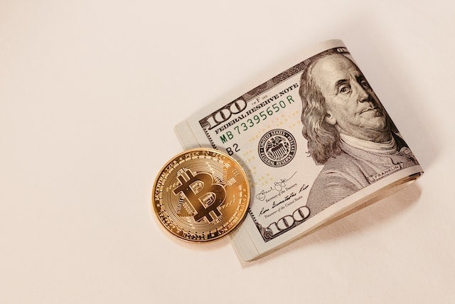 dollar note and a bitcoin