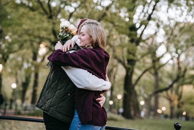 a couple hugging in the park
