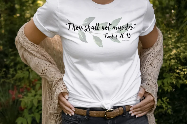 a woman wearing exodus 20:13 bible verse shirt