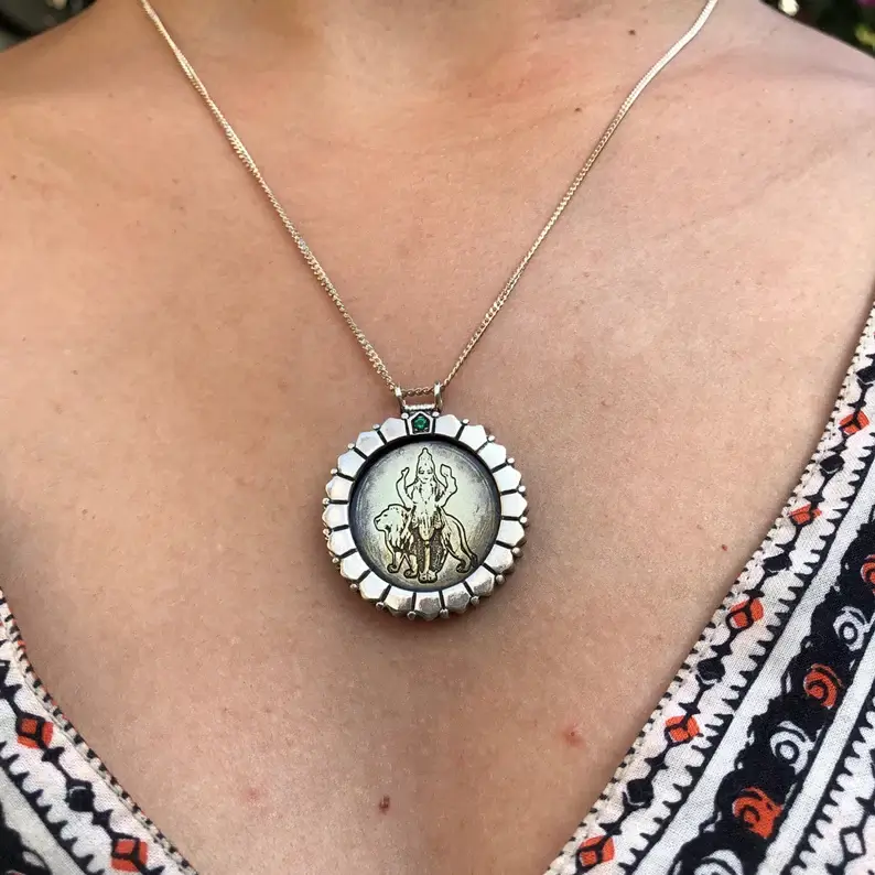 mercury yantra necklace on the neck
