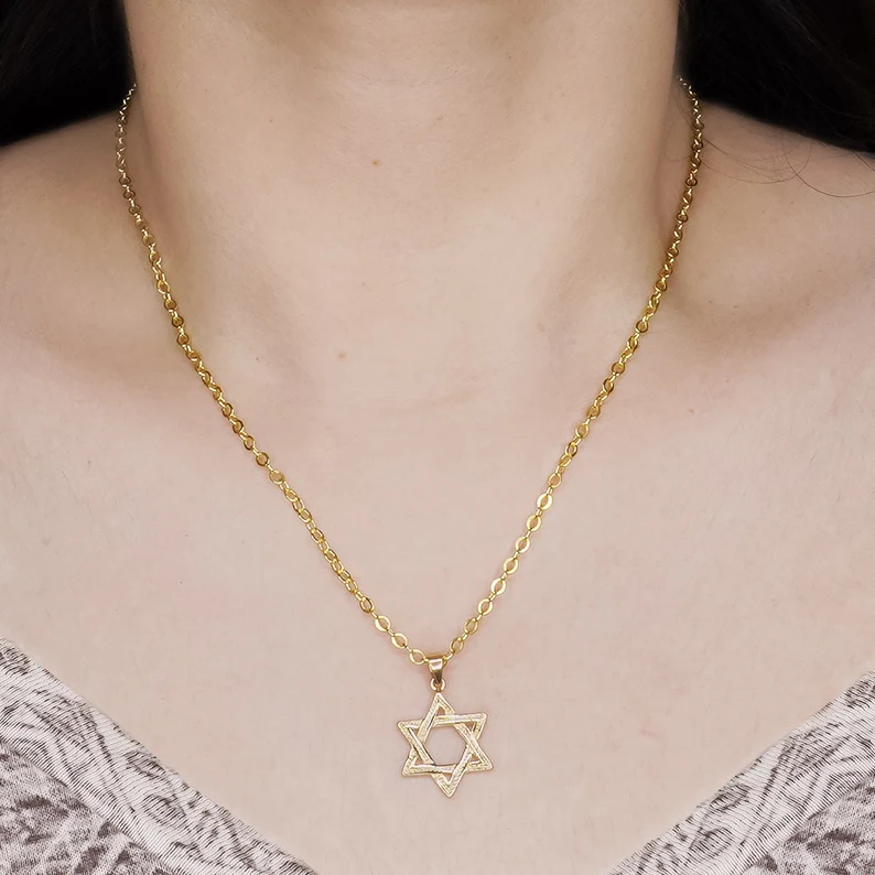 a hexagram necklace on the neck